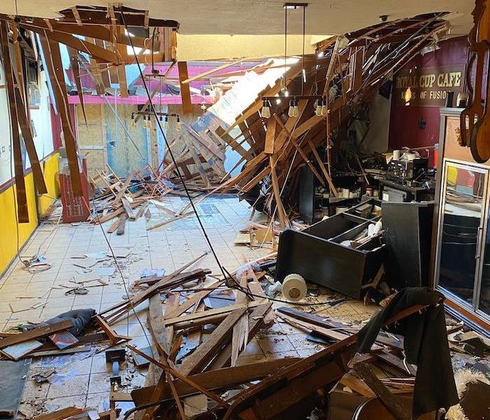 Business property with collapsed ceiling and debris