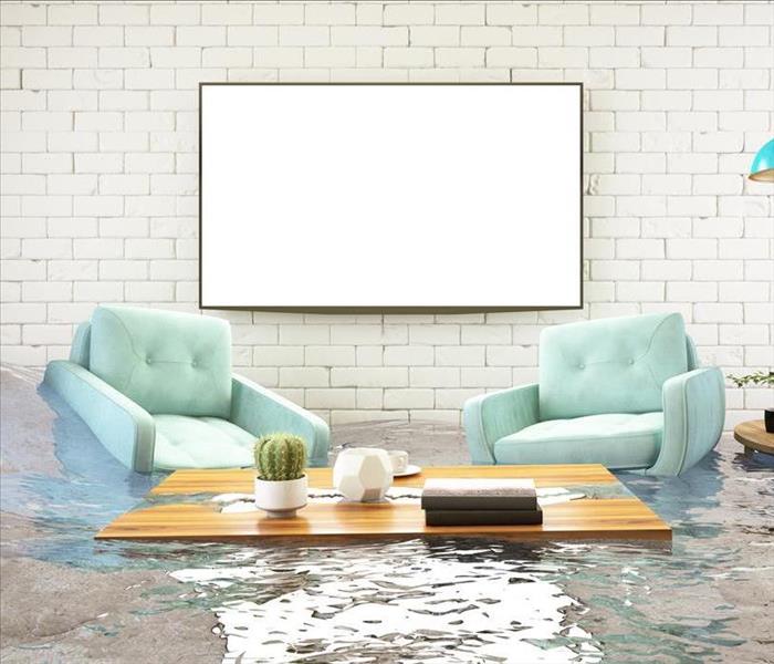 A living room with standing water damage. 